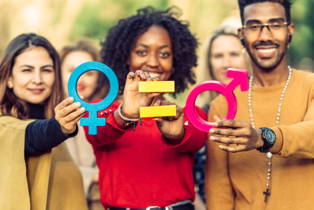woman-man-hold-feminine-masculine-signs-while-second-woman-holds-sign-equality-feminism (2)